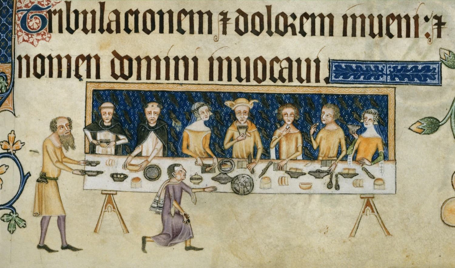 Luttrell Psalter, Sir Geoffrey Luttrell at table, c. 1325–40 — diners against a dark diapered ground above a blackletter psalm line, servants standing on bare vellum below